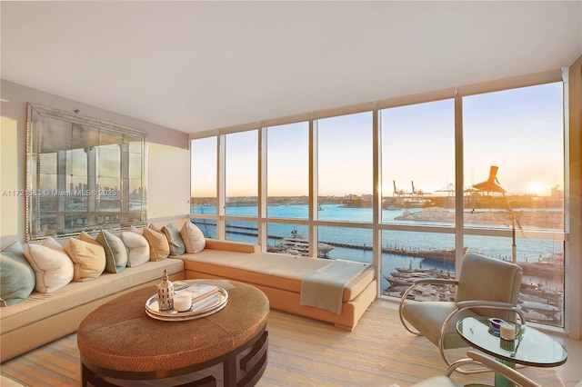 sunroom / solarium with a water view