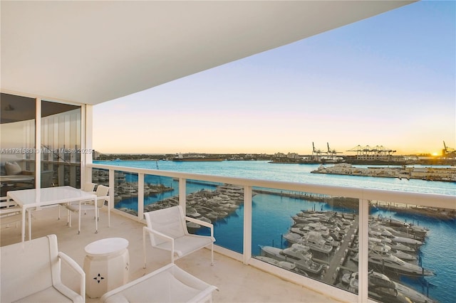 balcony at dusk with a water view