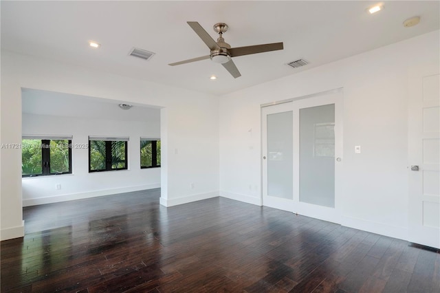 empty room featuring ceiling fan and dark hardwood / wood-style flooring