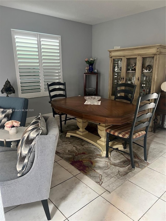 dining area featuring light tile patterned floors