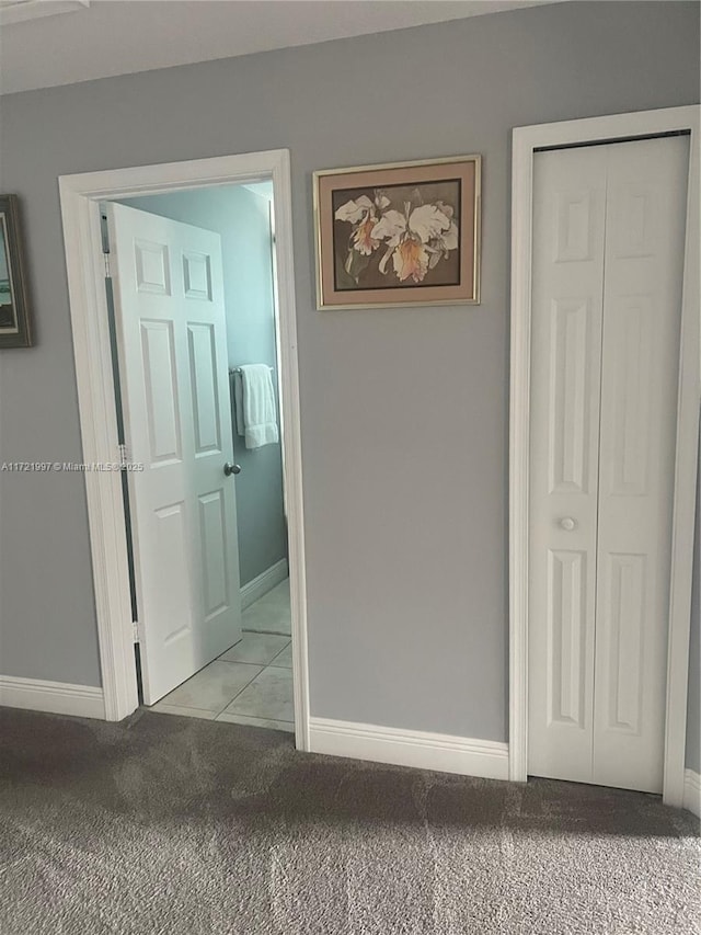 corridor with light colored carpet