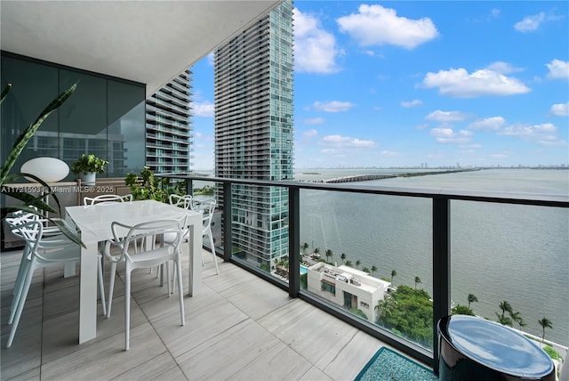 balcony featuring a water view