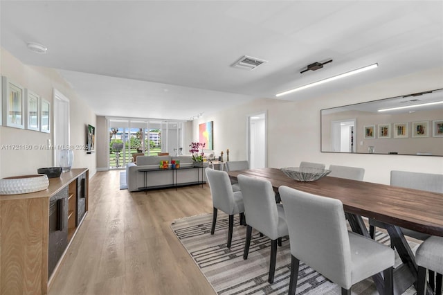 dining area with light wood-type flooring