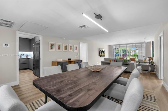 dining room featuring light hardwood / wood-style flooring