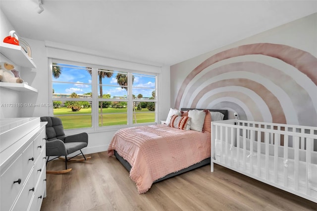 bedroom featuring light hardwood / wood-style flooring