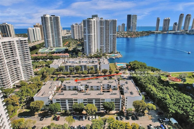 birds eye view of property with a water view