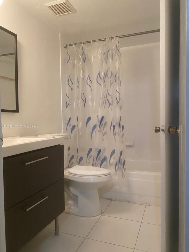 full bathroom with tile patterned flooring, vanity, toilet, and shower / bathtub combination with curtain