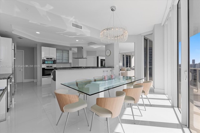 tiled dining room featuring a tray ceiling, wine cooler, and a notable chandelier