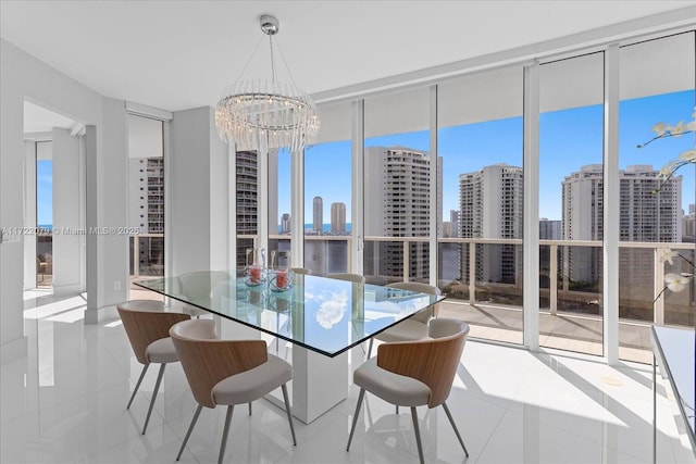 dining room with floor to ceiling windows, light tile patterned floors, and an inviting chandelier