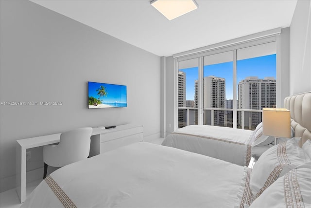 bedroom featuring a wall of windows