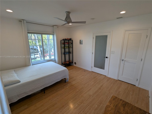 bedroom featuring ceiling fan and light wood-type flooring