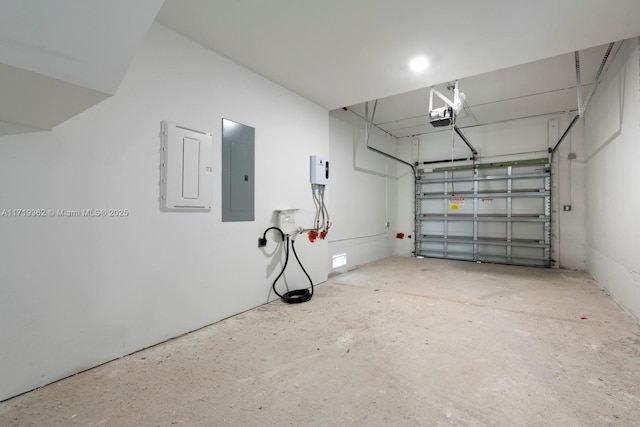 garage with electric panel and a garage door opener