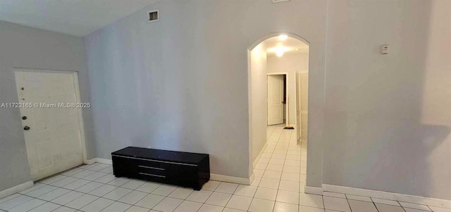 hallway featuring light tile patterned floors