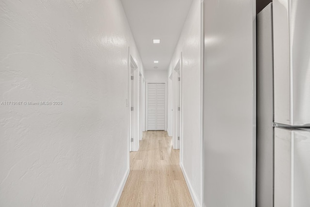 hallway featuring light wood-type flooring