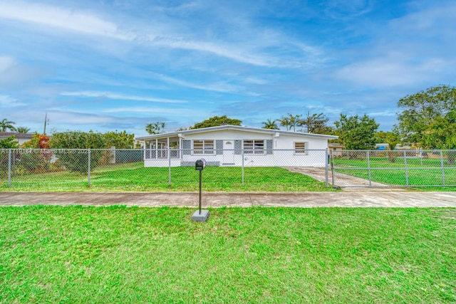 ranch-style home featuring a front yard