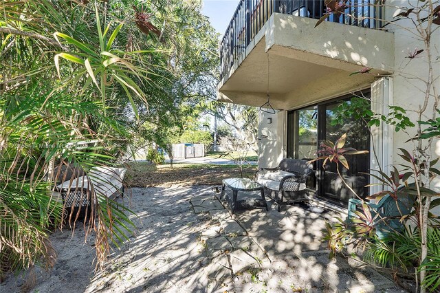 view of yard with a balcony