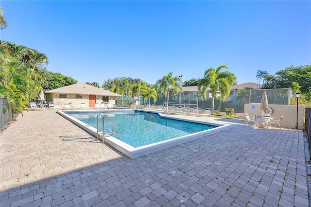 view of swimming pool featuring a patio area