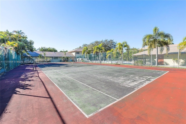 view of tennis court with fence