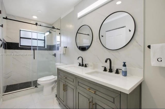 bathroom featuring toilet, vanity, and walk in shower