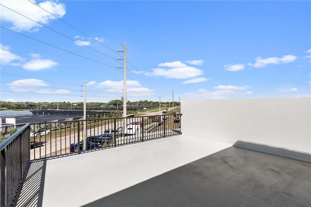 view of patio featuring a balcony