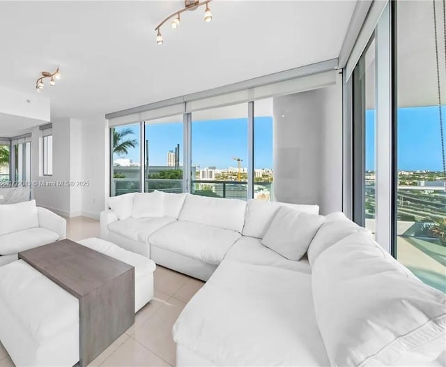 living room with light tile patterned floors and a wealth of natural light