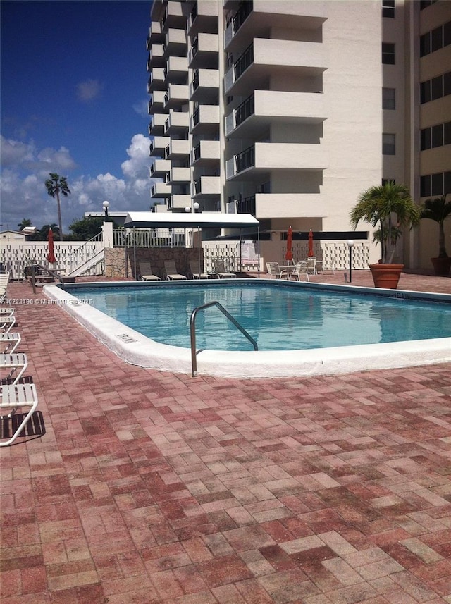 view of pool featuring a patio