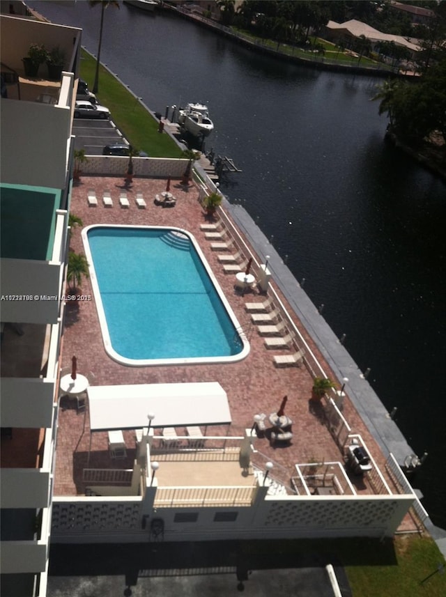 view of pool with a water view