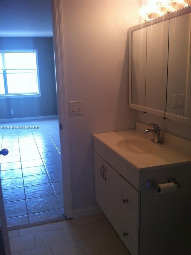 bathroom with tile patterned floors and vanity