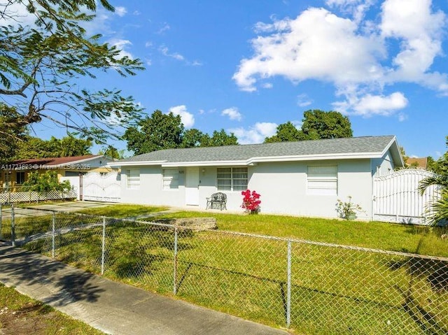 ranch-style house with a front lawn