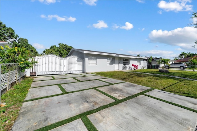 ranch-style house featuring a front lawn