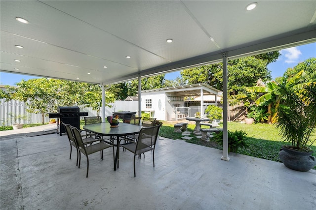 view of patio / terrace with grilling area and an outdoor structure