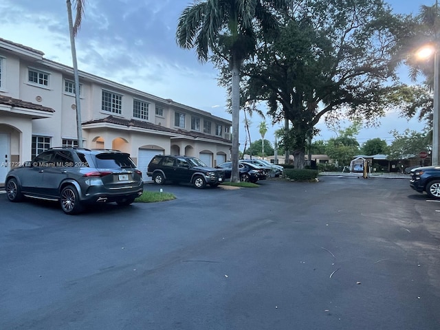 view of vehicle parking with a garage