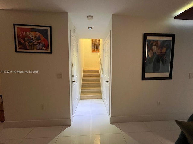 corridor featuring light tile patterned floors