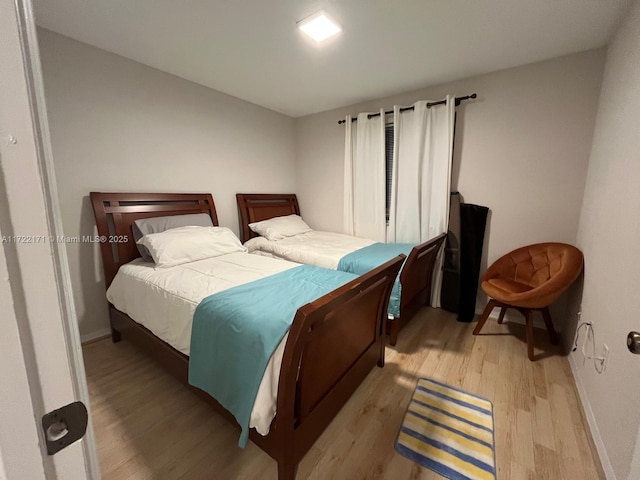 bedroom with light wood-type flooring