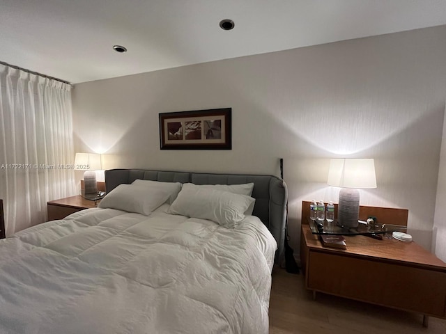 bedroom featuring wood-type flooring