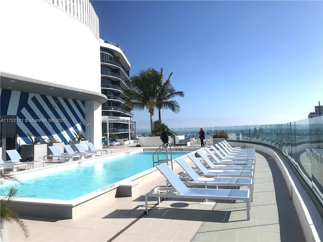 view of swimming pool with a patio