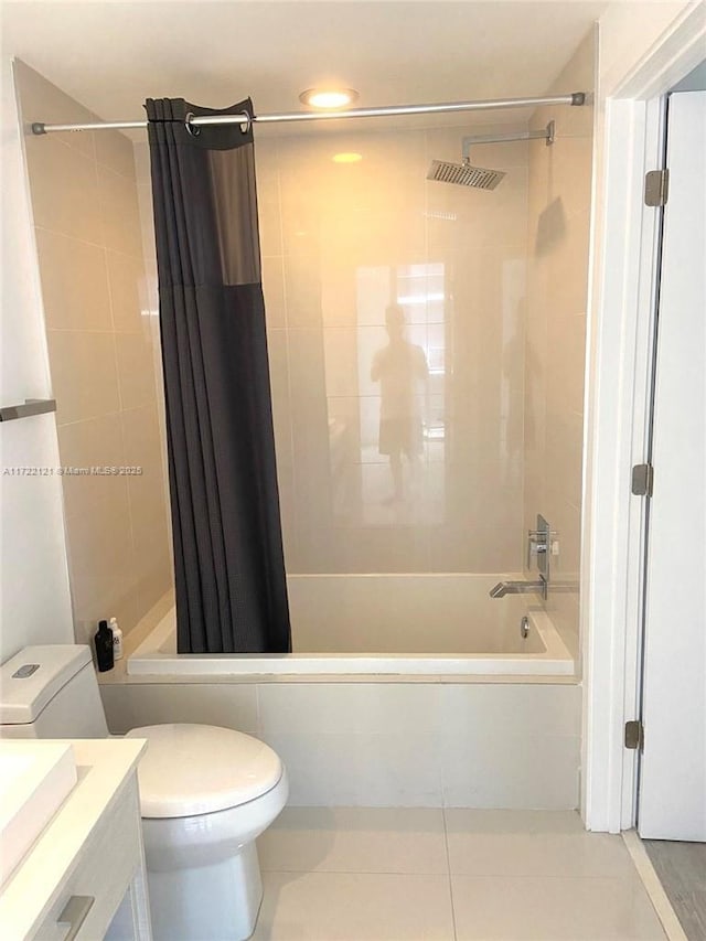 full bathroom with tile patterned floors, shower / bathtub combination with curtain, vanity, and toilet