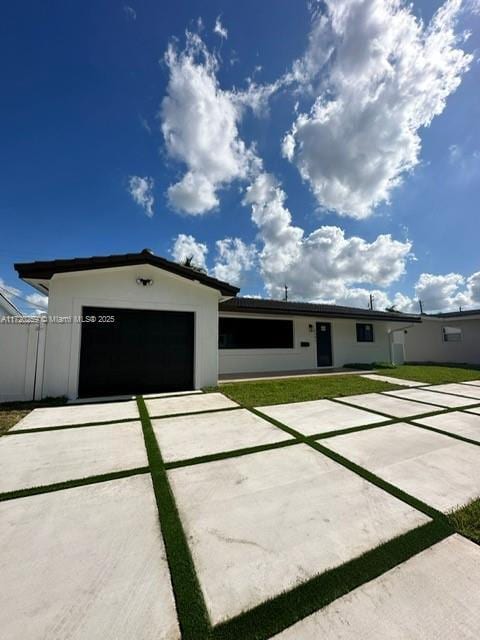 ranch-style house featuring a garage