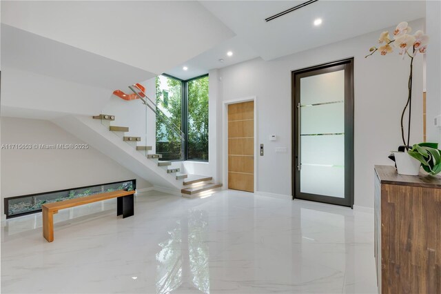 living room with marble finish floor, visible vents, and recessed lighting