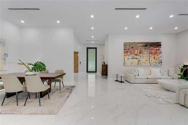 living area featuring marble finish floor, visible vents, and recessed lighting