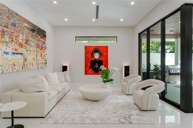 living room featuring a healthy amount of sunlight and recessed lighting