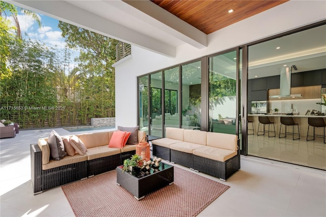 view of patio with fence and an outdoor living space