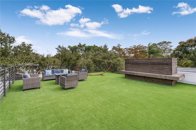 view of yard with an outdoor hangout area and fence