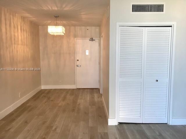 hallway featuring hardwood / wood-style flooring