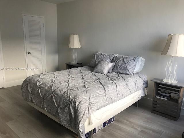 bedroom with wood-type flooring