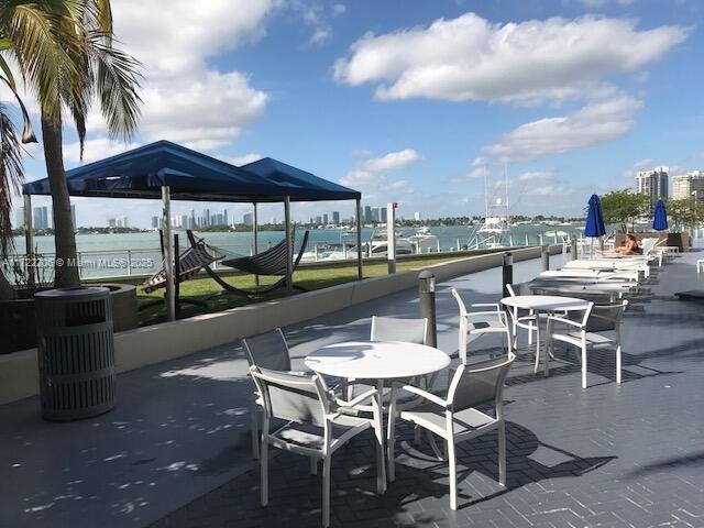 view of patio featuring a water view