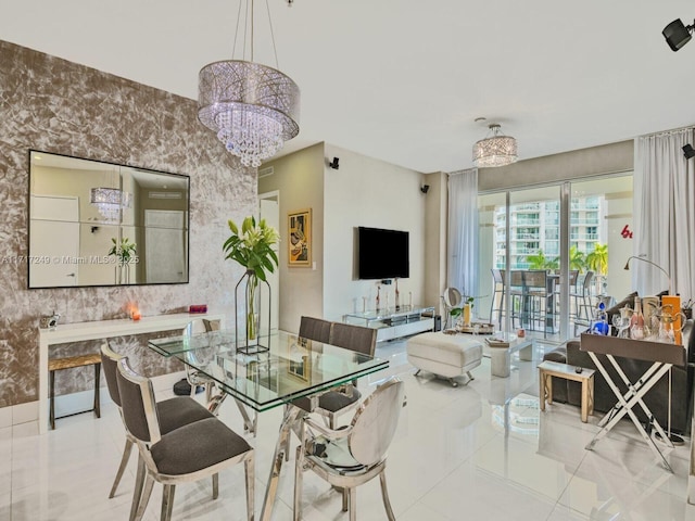 dining room featuring light tile patterned flooring, wallpapered walls, and an inviting chandelier