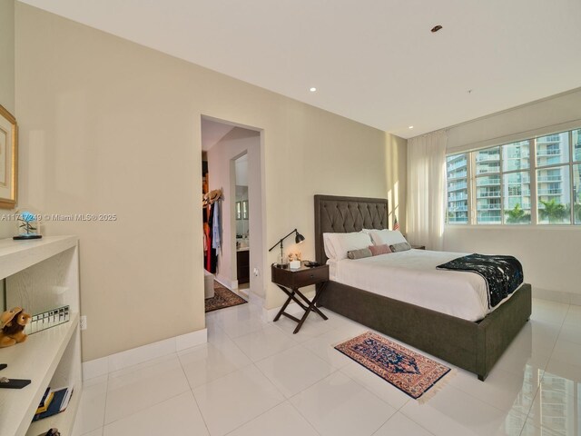 living room featuring light tile patterned flooring and a notable chandelier