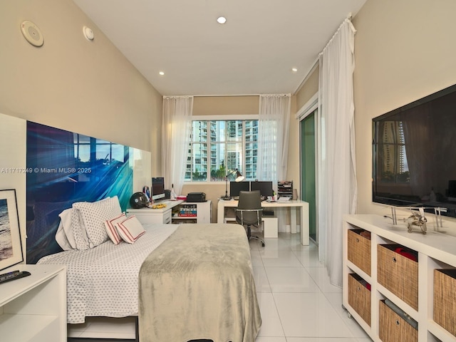 bedroom with recessed lighting and light tile patterned floors