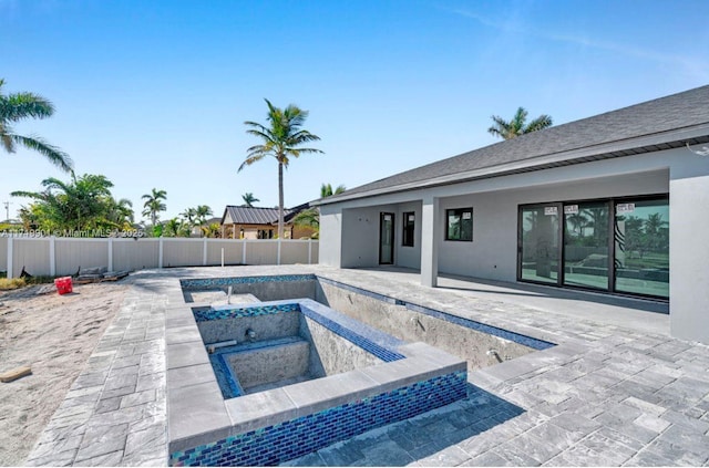 view of pool featuring a patio and a hot tub